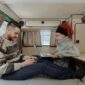 A Couple Remote Working from a Campervan