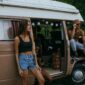 Friends Hanging Out by the Side of a Camper Van